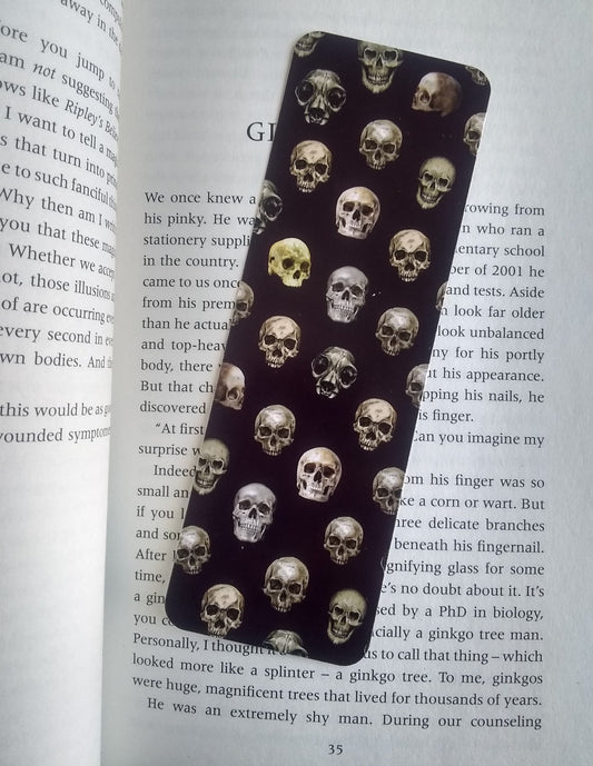 Bookmark with a skull pattern on a book. 