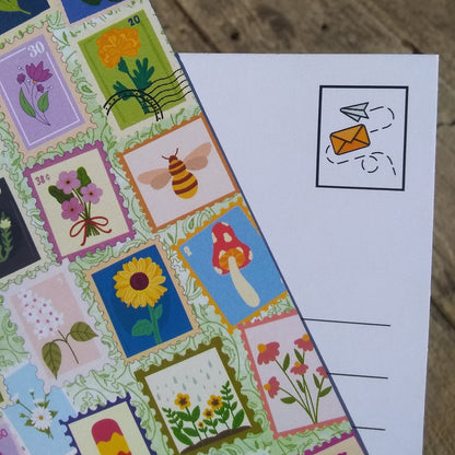 Colorful stamp-like designs on a postcard with a wooden surface background