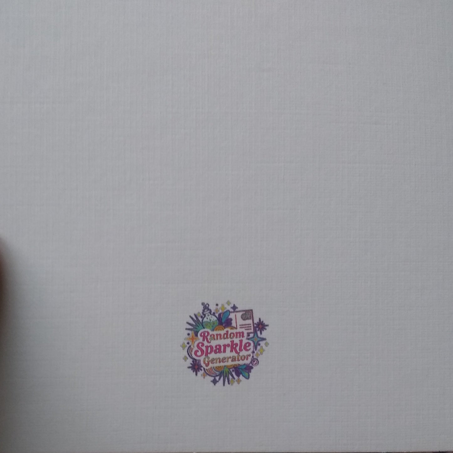 Colorful logo on a white background with a hand holding the edge of the paper.