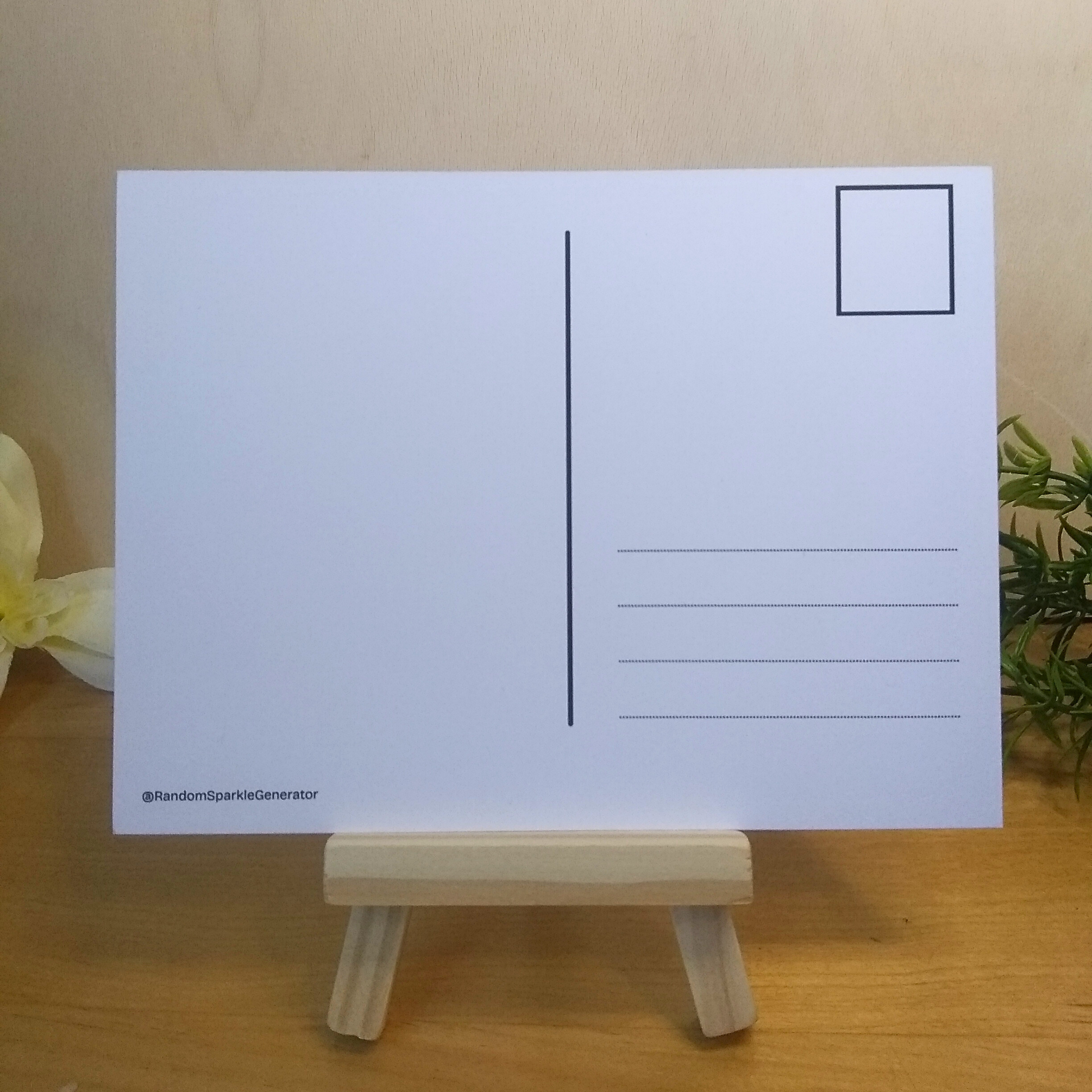 Blank postcard back on a wooden stand on a light wooden surface