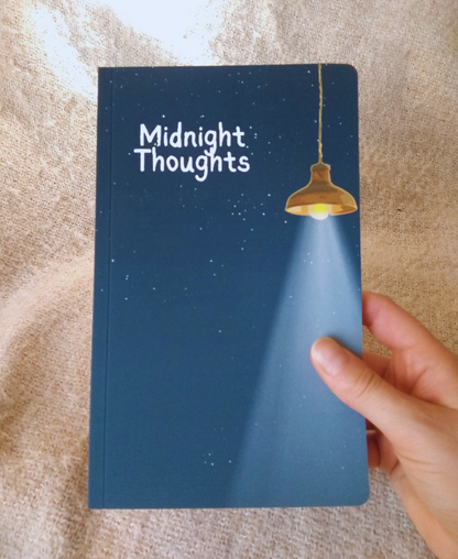 Notebook titled 'Midnight Thoughts' with a lamp illustration on a textured surface